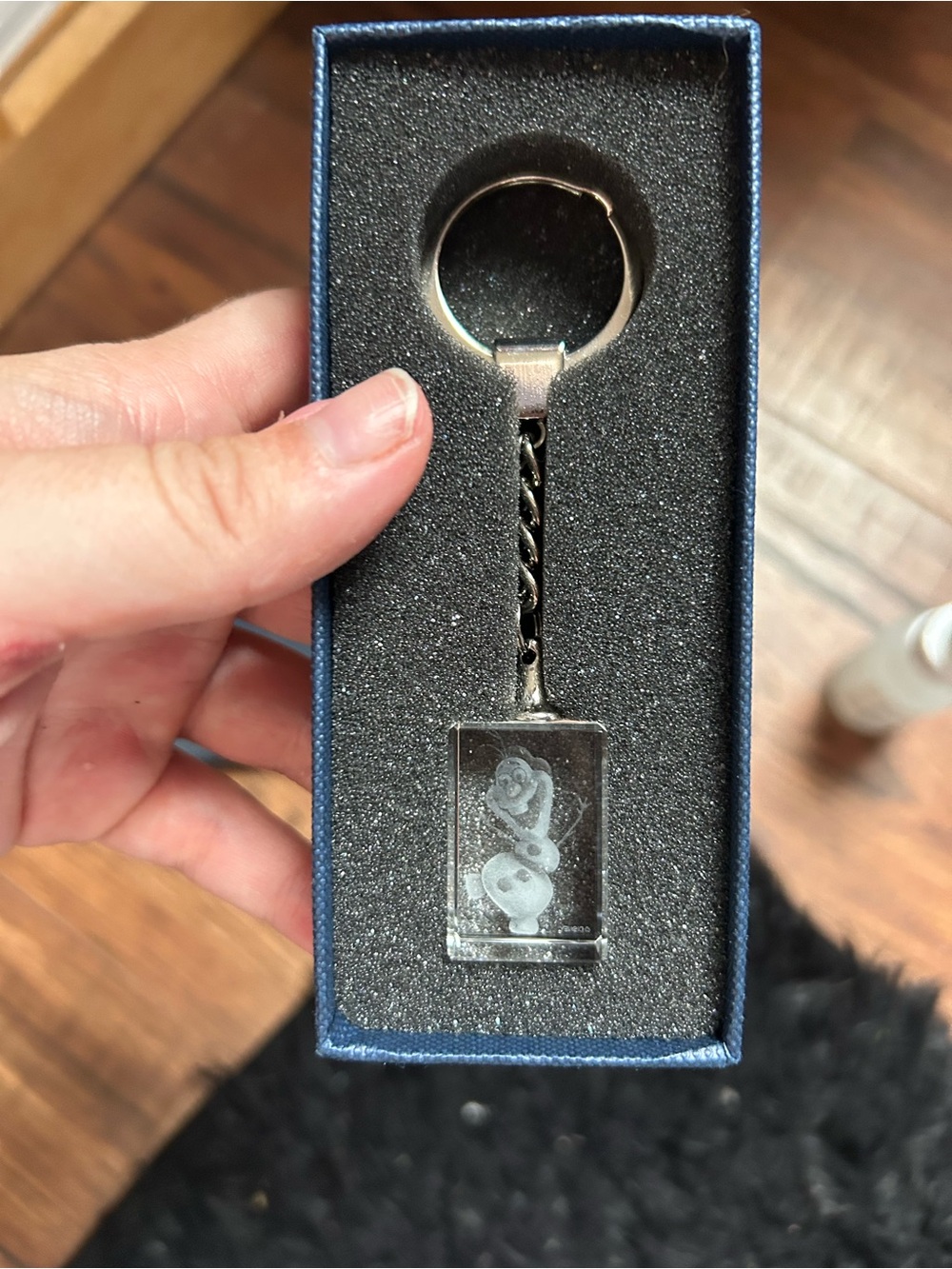 Disney Frozen Olaf keychain with Olaf's face in a clear rectangular pendant